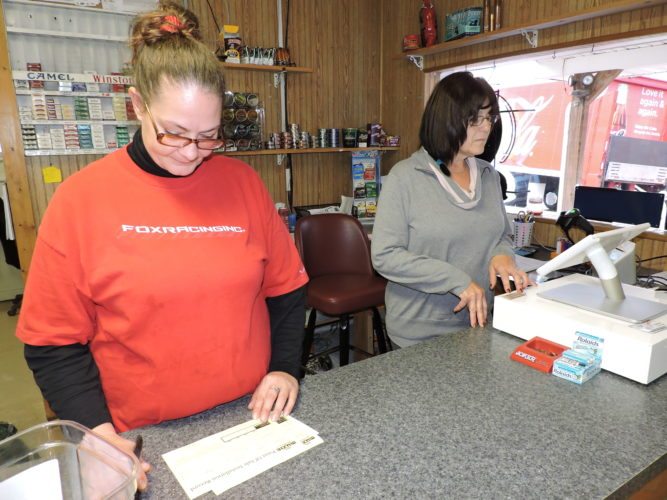 Photo by Casey Junkins Liz Moskal, left, and Mary Saffell, employees at the JLK Carryout near the Powhatan No. 6 Mine, said the planned December mine closure will devastate the local economy. 